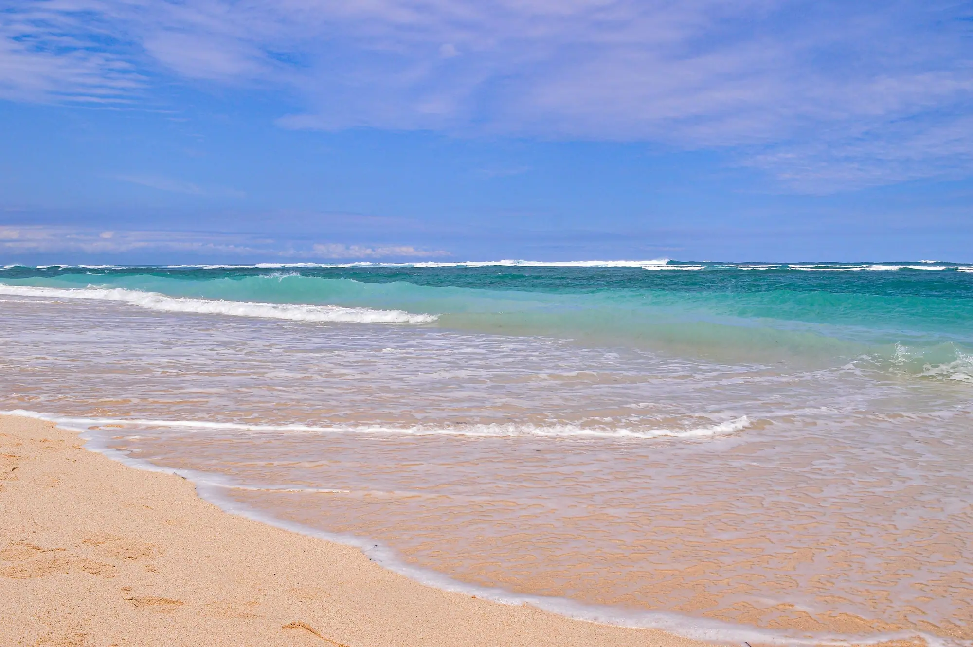 Waves on the sand at Pandawa Beach, Bali