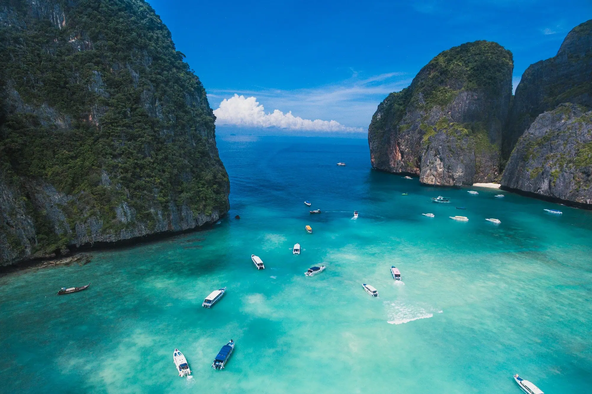 Boats in the turquoise water of Maya Bay, Phi Phi Islands